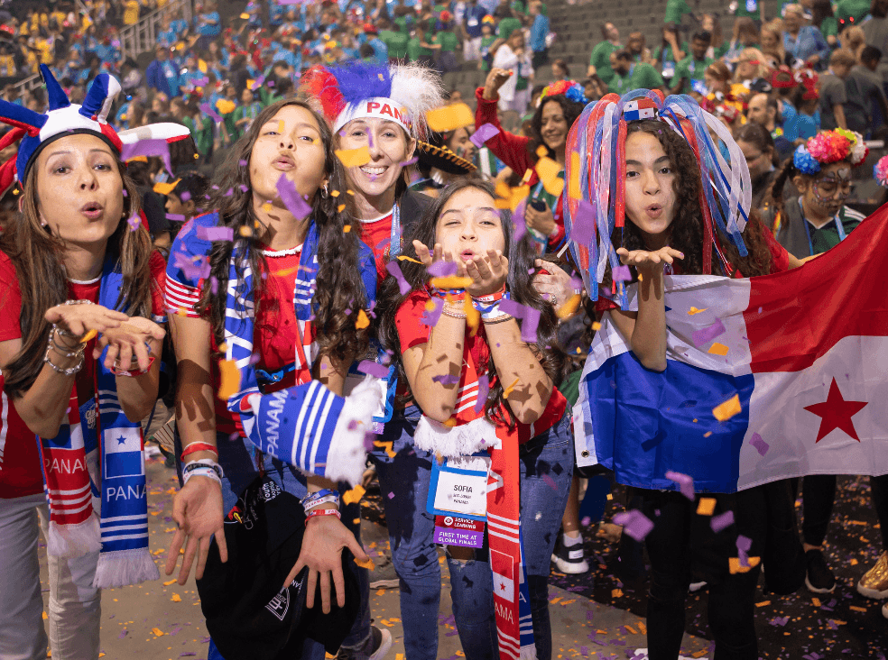 Students celebrating with confetti at a Destination Imagination tournament